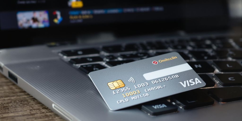 Credit card and laptop representing online payments.
