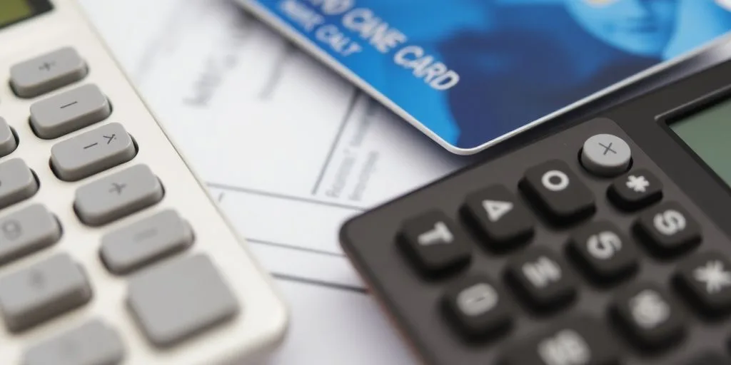 Credit cards and calculator on a desk for finance.